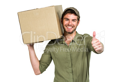 Handsome postman holding pack showing thumbs up