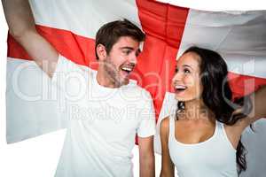 Happy couple holding England flag