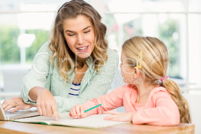 Mother checking daughters homework