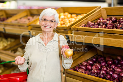 Senior woman picking out some vegetables