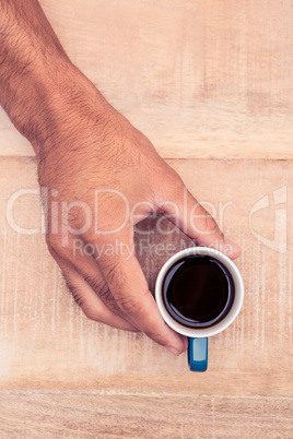 Businessman holding black coffee