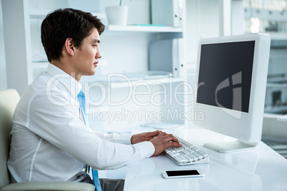 Asian businessman using his computer