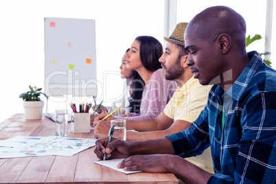 Colleagues sitting in conference room