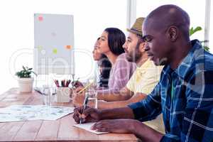 Colleagues sitting in conference room