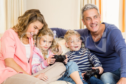 Happy family enjoying video games together