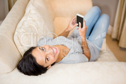 Brunette using smartphone