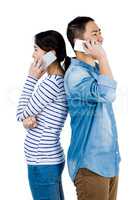 Cheerful couple talking on phone