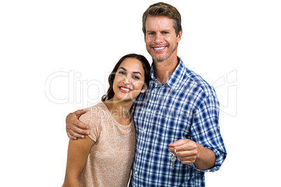 Portrait of cheerful couple with keys