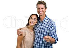 Portrait of cheerful couple with keys