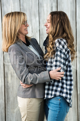 Mother and daughter smiling