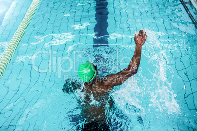 Fit man swimming in the pool