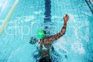 Fit man swimming in the pool