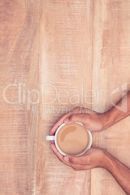 Directly above view of businessman holding coffee