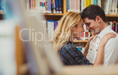 Couple with books looking at each other