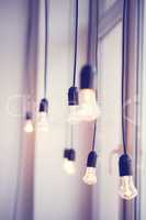 iful festoon light bulb hanging at the window. Lighting decor