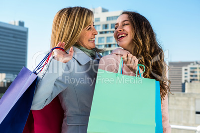 Mother and daughter smiling