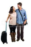 Cheerful couple with luggage