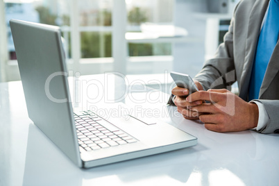 close up view of a businessman using his phone