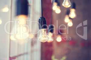 iful festoon light bulb hanging at the window. Lighting decor