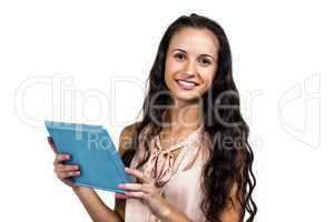 Smiling woman using tablet looking at camera