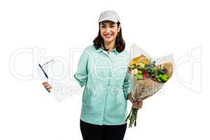 Portrait of happy delivery woman with flower bouquet