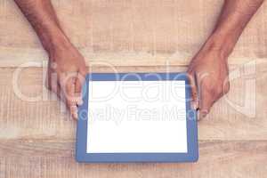 Person holding on digital tablet