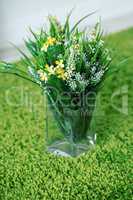 Beautiful field of colorful flowers in a glass vase, a bouquet for March 8, birthday or St. Valentine's day