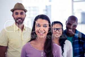 Young businesswoman standing with team