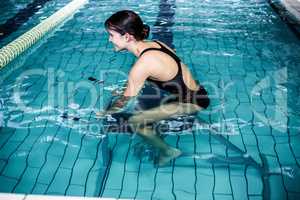 Woman cycling in the pool