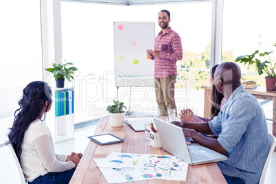 Confident businessman giving presentation