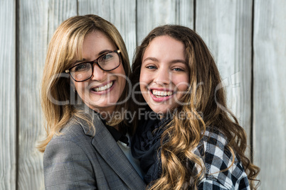 Mother and daughter smiling