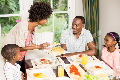 Happy family eating together