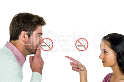 Couple with stop Smoking sign