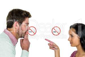 Couple with stop Smoking sign