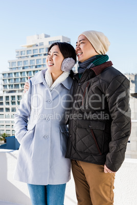 Happy couple looking away