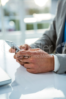 close up view of a businessman using his phone