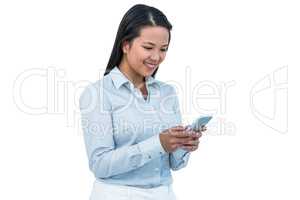 Smiling businesswoman using her smartphone