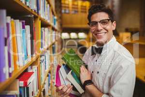 Portrait of nerd holding books