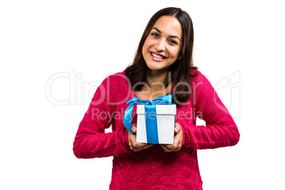 Portrait of beautiful young woman holding gift box