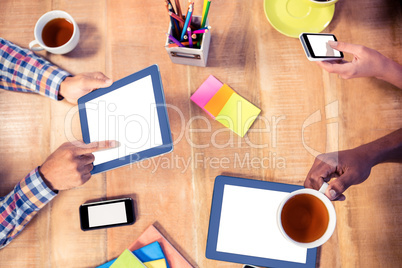 Cropped image of business people using technologies