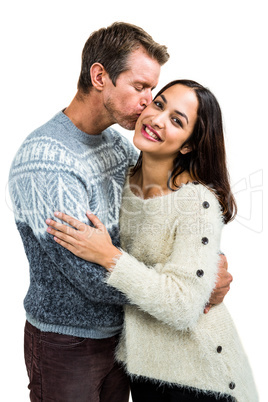 Boyfriend kissing girlfriend while embracing