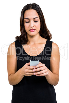 Serious beautiful woman using phone