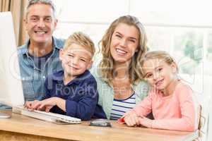 Happy family using the computer
