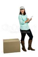 Happy delivery woman with clipboard standing by box