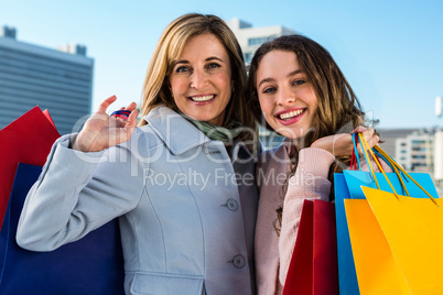 Mother and daughter smiling