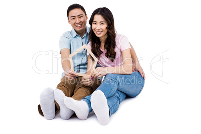 Happy couple holding frame