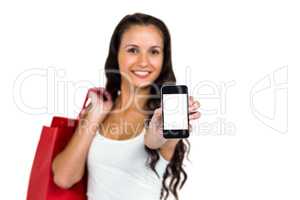 Portrait of smiling woman showing smartphone
