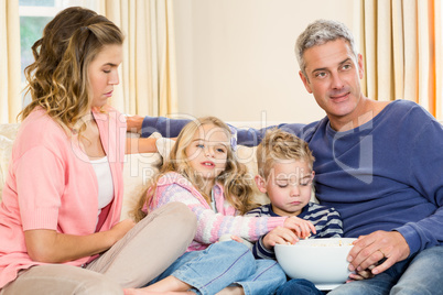 Happy family enjoying a movie together