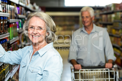 Smiling senior woman choosing food