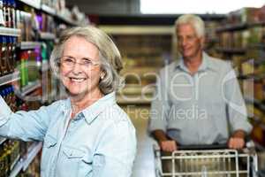 Smiling senior woman choosing food